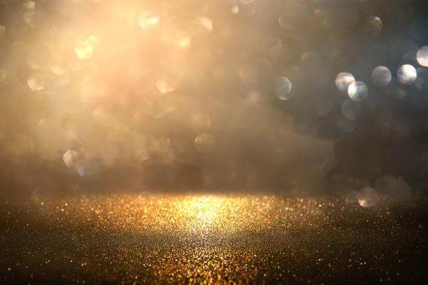 istock glitter vintage lights background. gold and black. de-focused. 1157382819