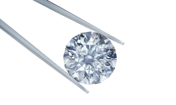 istock Single diamond in tweezers 1157383594
