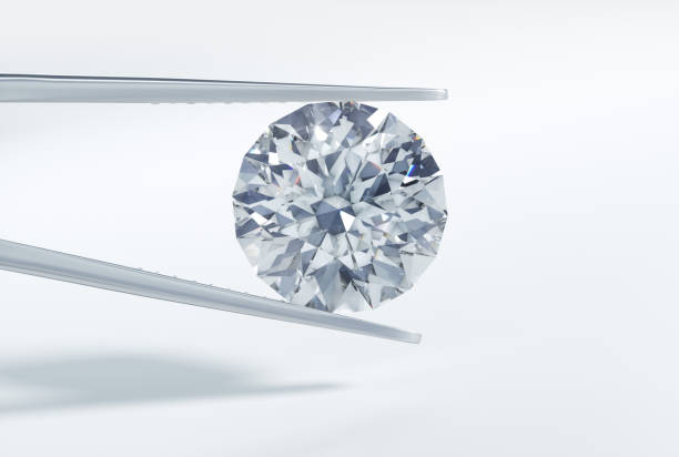 istock Single diamond in tweezers 1157383612