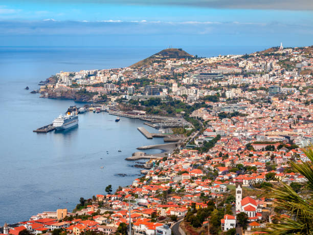 Funchal-Madeira Island A beautiful view over Funchal towards a cruise ship in Madeira Island. funchal stock pictures, royalty-free photos & images