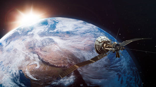 istock Spacecraft orbiting the earth at sunrise - 3D Illustration 1157385441