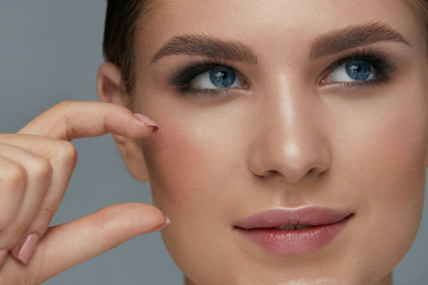 istock Beauty face makeup. Woman with beautiful eyes and eyebrows 1157385914