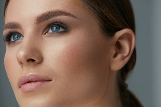 istock Beauty makeup. Woman face with eyes and eyebrows make-up 1157387000