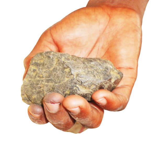 Africa,A piece of Coltan ore in Congolese hand ,conflicting mineral is widely used in the most  modern technology stock photo