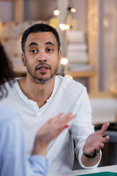 istock Unrecognizable teen gestures in serious discussion with dad 1157387322