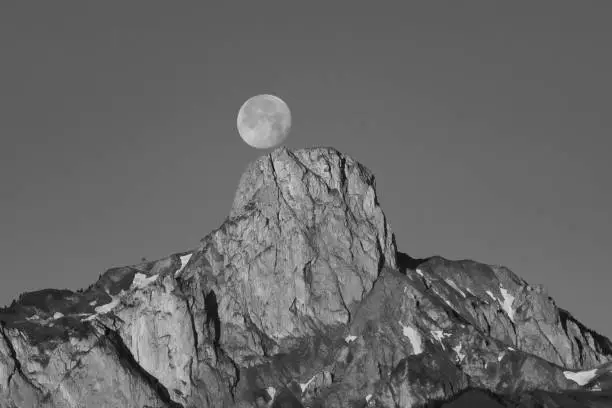 The full moon dances over the Stockhorn (mountain in Canton Bern, Switzerland)