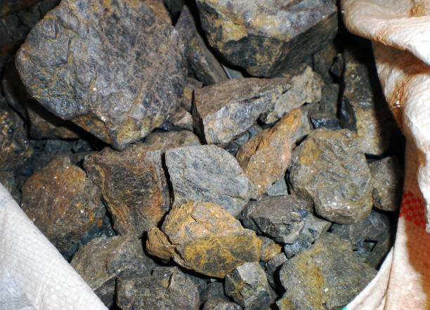 Coltan ore contains metals of Tantalum and Niobium without them the productions of smart phones, laptops and condensers of all other electronic products related to contemporary world. stock photo