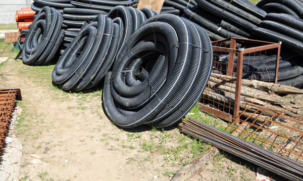 istock construction site with many corrugated pipes for laying fiber op 1157390458