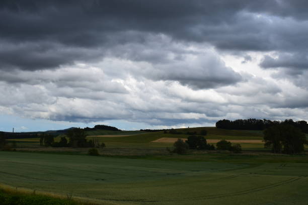 istock dark clouds in rail storm over Eifel landscape 1157391109