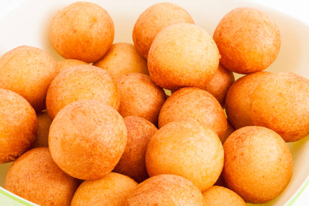 istock Traditional Colombian buuelo - Deep Fried Cheese Bread on white background 1157393162