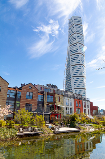 Malmo, Sweden: April 20, 2019: Modern architecture in Vastra Hamnen district, with the Turning Torso building from spanish arquitect Santiago Calatrava