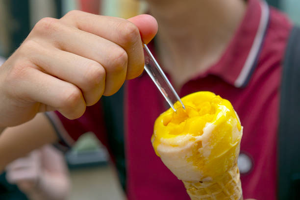 An Ice Cream cone. It is shot in close up with focus on the foreground.