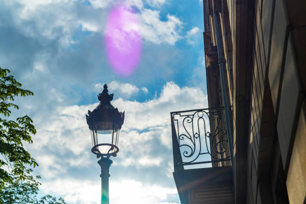 Bordeaux, France upstairs window in a residential street with the setting sun in the background,