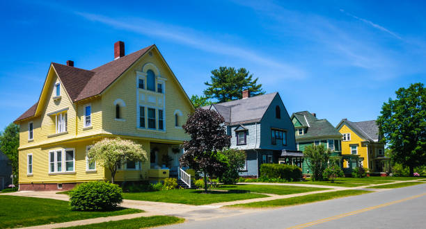 Vermont Neighborhood A row of well maintained, colorful,  19th century homes along a quiet street   in a northern Vermont small town. Gable stock pictures, royalty-free photos & images
