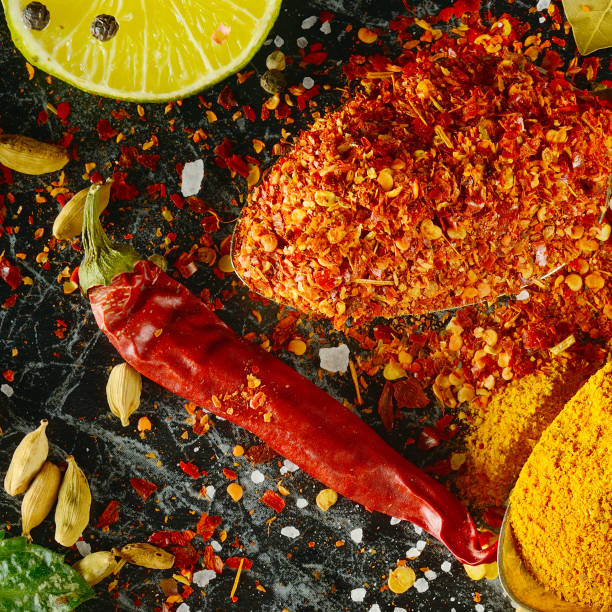 istock Variety of spices and herbs on kitchen table. 1157404286