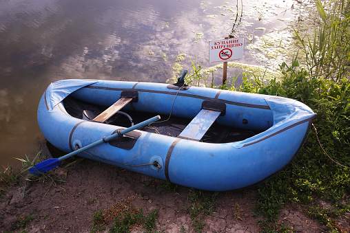 Inflatable boat on the river Bank. Details and close-up