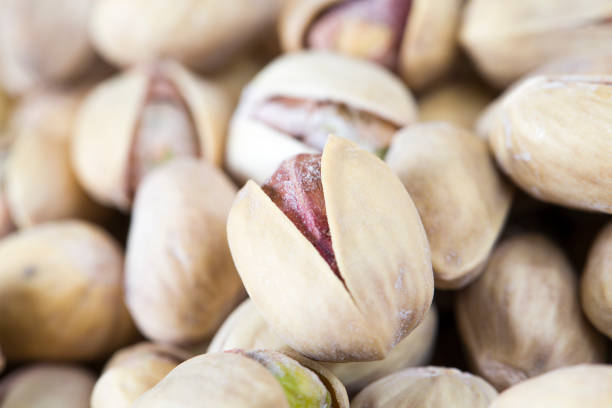 istock Delicious fried salted pistachios 1157414882