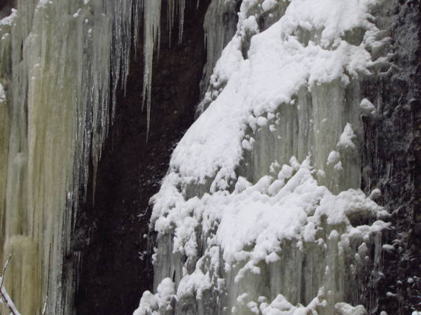 istock Frozen waterfall on rocks winter scenic 1157415363