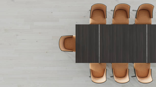 istock Part of a Rectangular Wooden Table with Orange Linen Chairs 1157425596