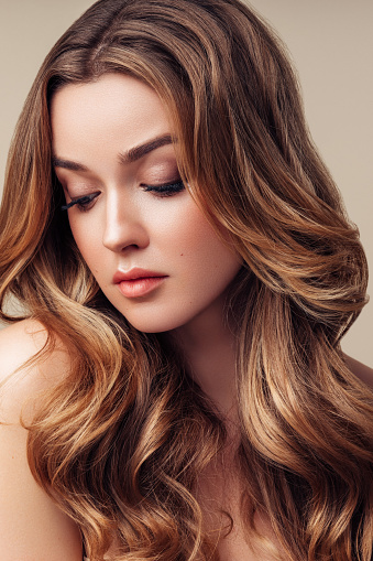 Young Beautiful Model With Long Wavy Well Groomed Hair Stock Photo -  Download Image Now - iStock
