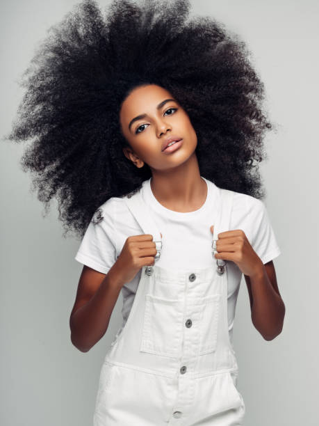 istock Beautiful smiling girl with curly hairstyle 1157426704