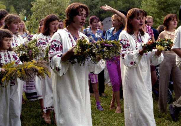 Kiev, Ukraine - 7 July 2017 People celebrate holiday of Ivana Kupala on natural nature. Traditional event Ivana Kupala is divination female to male gender. Religion rite Ivana Kupala in summer days.