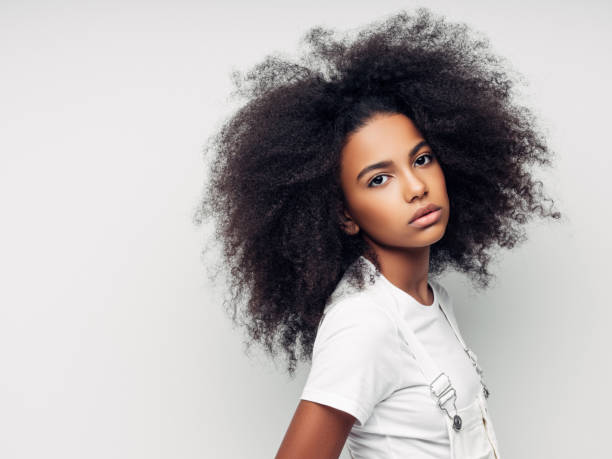 istock Beautiful smiling girl with curly hairstyle 1157426838
