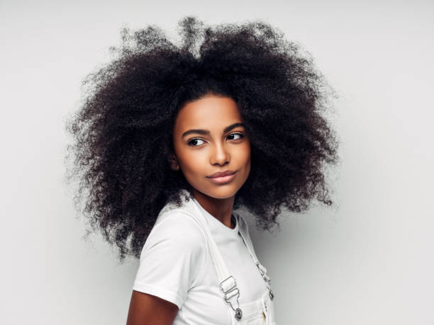 istock Beautiful smiling girl with curly hairstyle 1157426866