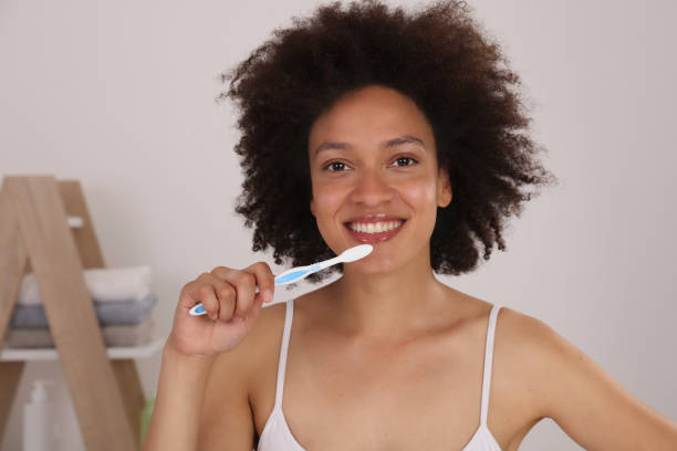 istock Young Woman Brushing Teeth. Oral hygiene 1157427983