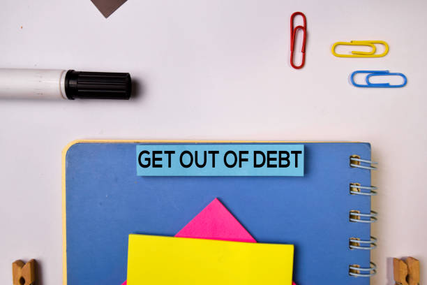 istock Get Out of Debt on sticky notes isolated on white background. 1157430050