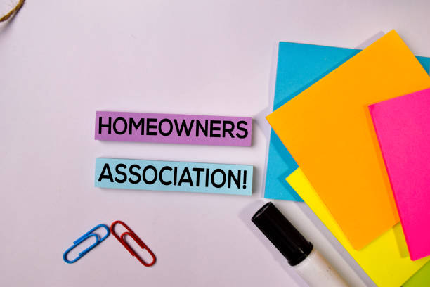 istock Homeowners Association! on sticky notes isolated on white background. 1157430329