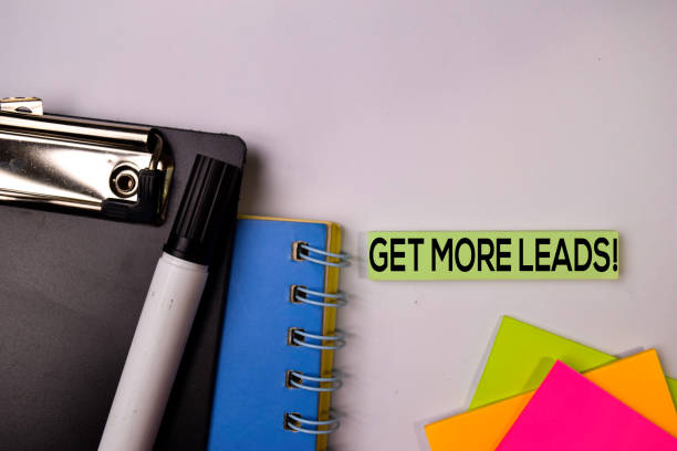 istock Get More Leads! on sticky notes isolated on white background. 1157430457