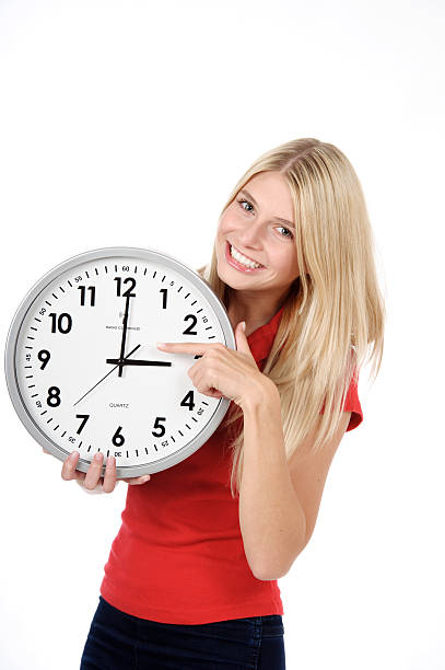 istock Blond beautiful woman with the clock 115743184