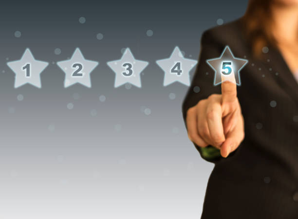 istock Businesswoman touching five stars 1157432526
