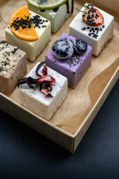 istock Raw vegan desserts in the box with fresh berries 1157436158