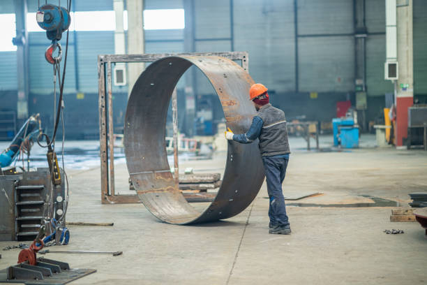 istock Worker pushing a metal ring in factory 1157439029