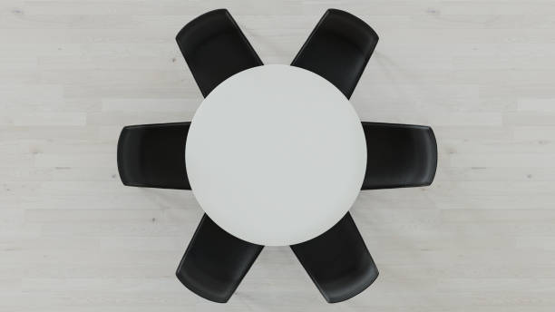 istock Top View of a White Circular Table with Empty Black Chairs 1157440221