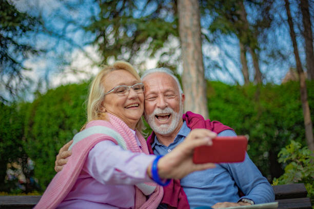 istock Senior couple enjoying in park 1157440883