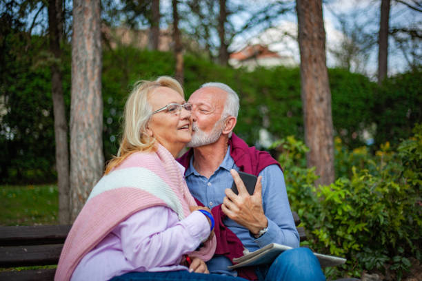 istock Senior couple enjoying in park 1157440951