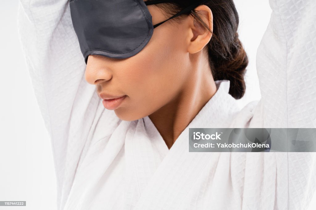 Young Woman With Blindfolds On Eyes Stretching Stock Photo