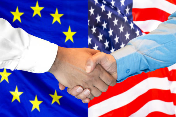 istock handshake on European Union and US flag background. 1157441286