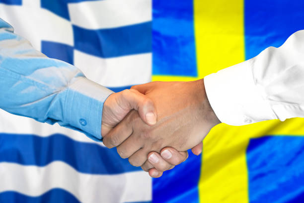 istock handshake on Greece and Sweden flag background. 1157442400