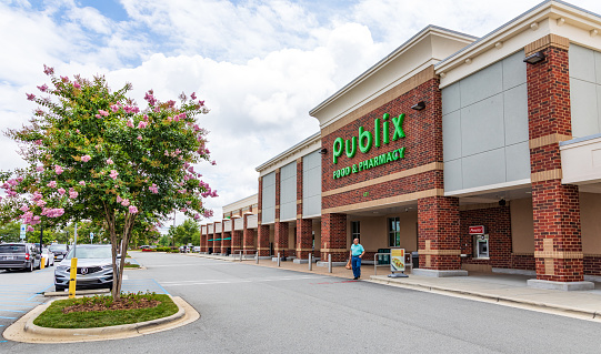 Mooresville, NC, USA-June 19, 2019: Publix Food & Pharmacy building and  parking lot.