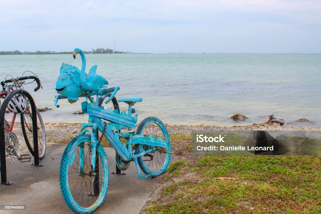 Blue bike at Bird Key Car Park - Sarasota, Florida Blue bike at Bird Key Car Park - Sarasota, Florida - June 9, 2019 Art Stock Photo