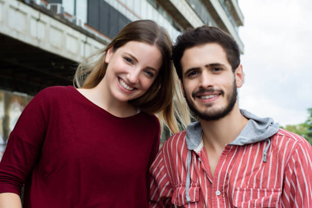 istock Two University students studying together outdoors 1157446183