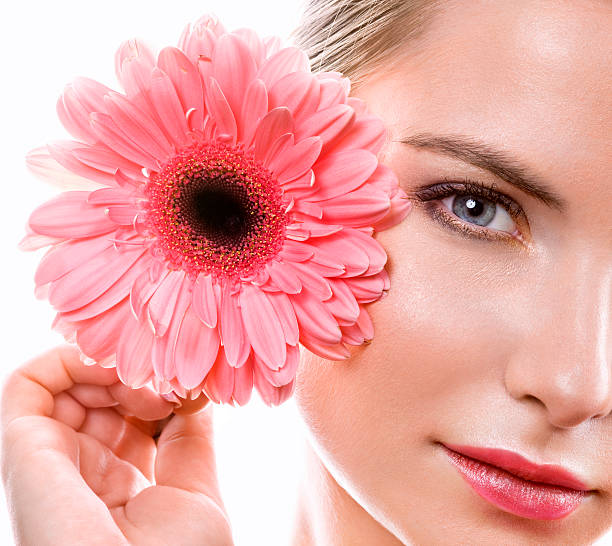 istock woman with pink flower 115744622