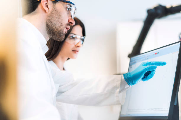 istock Male scientist pointing a finger to the computer screen in laboratory 1157447772
