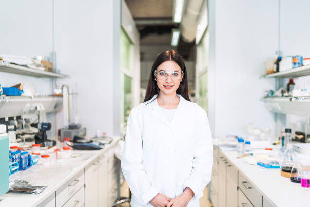istock Smiling female scientist in her laboratory 1157447809