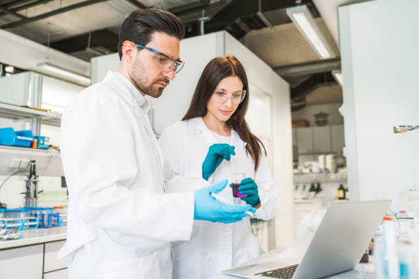 istock Scientist looking at results of an experiment on laptop screen 1157447819