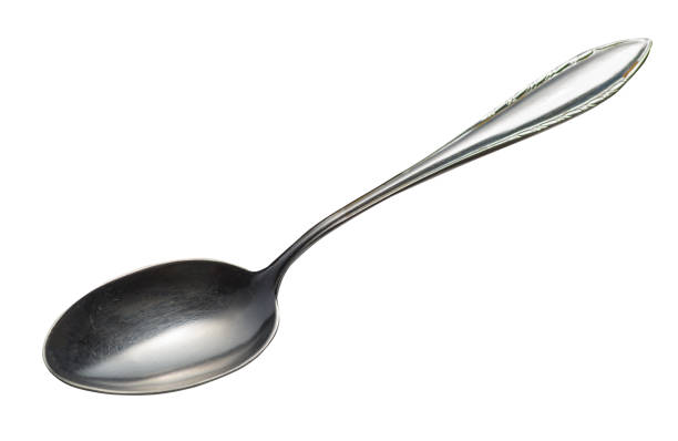 istock spoon isolated on white background. metal spoon. vintage spoon. 1157447836